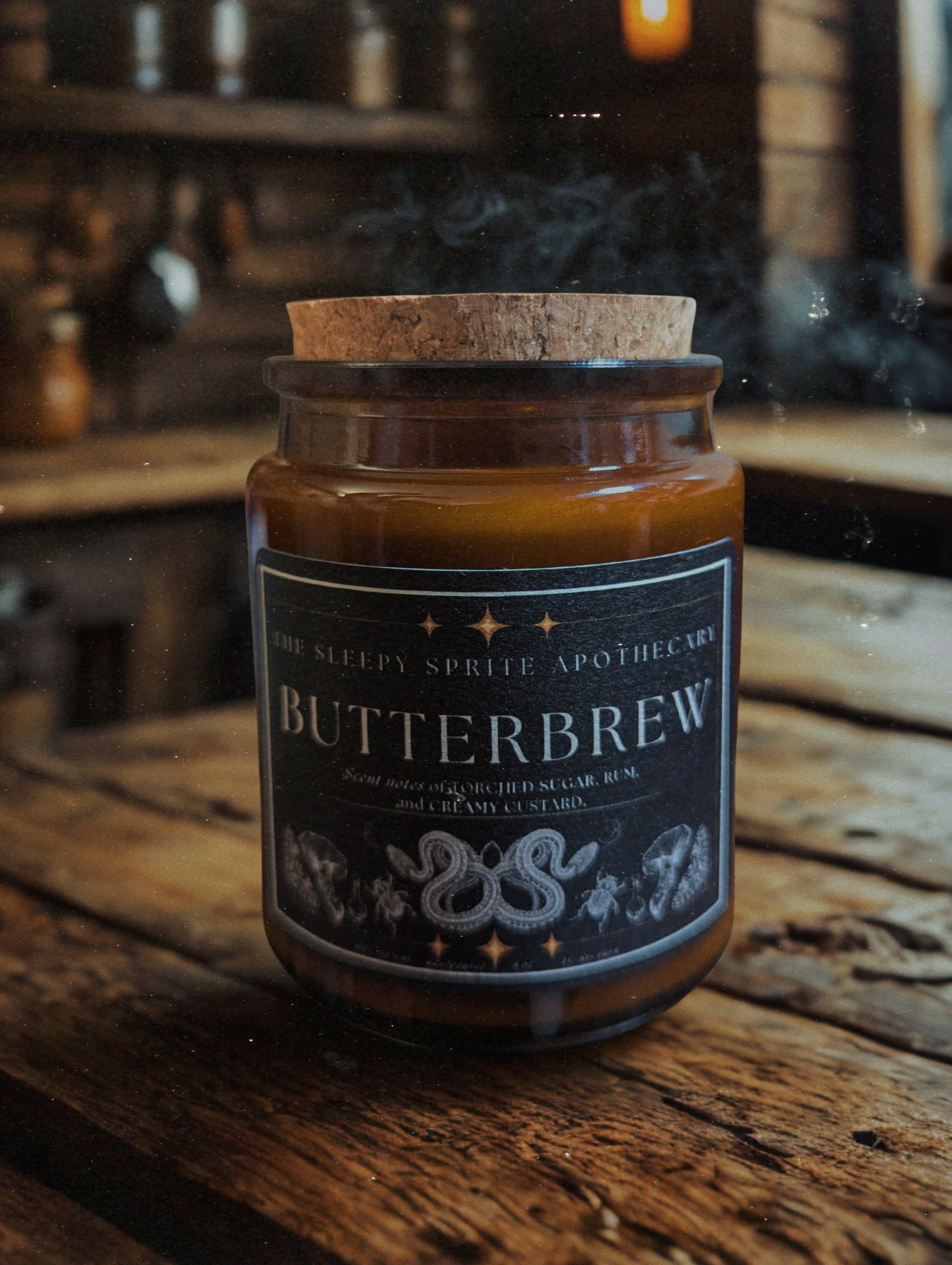 Butterbrew candle in a jar with a cork lid on a wooden surface. Harry Potter inspired candle. Witchy dark cottagecore aesthetic.