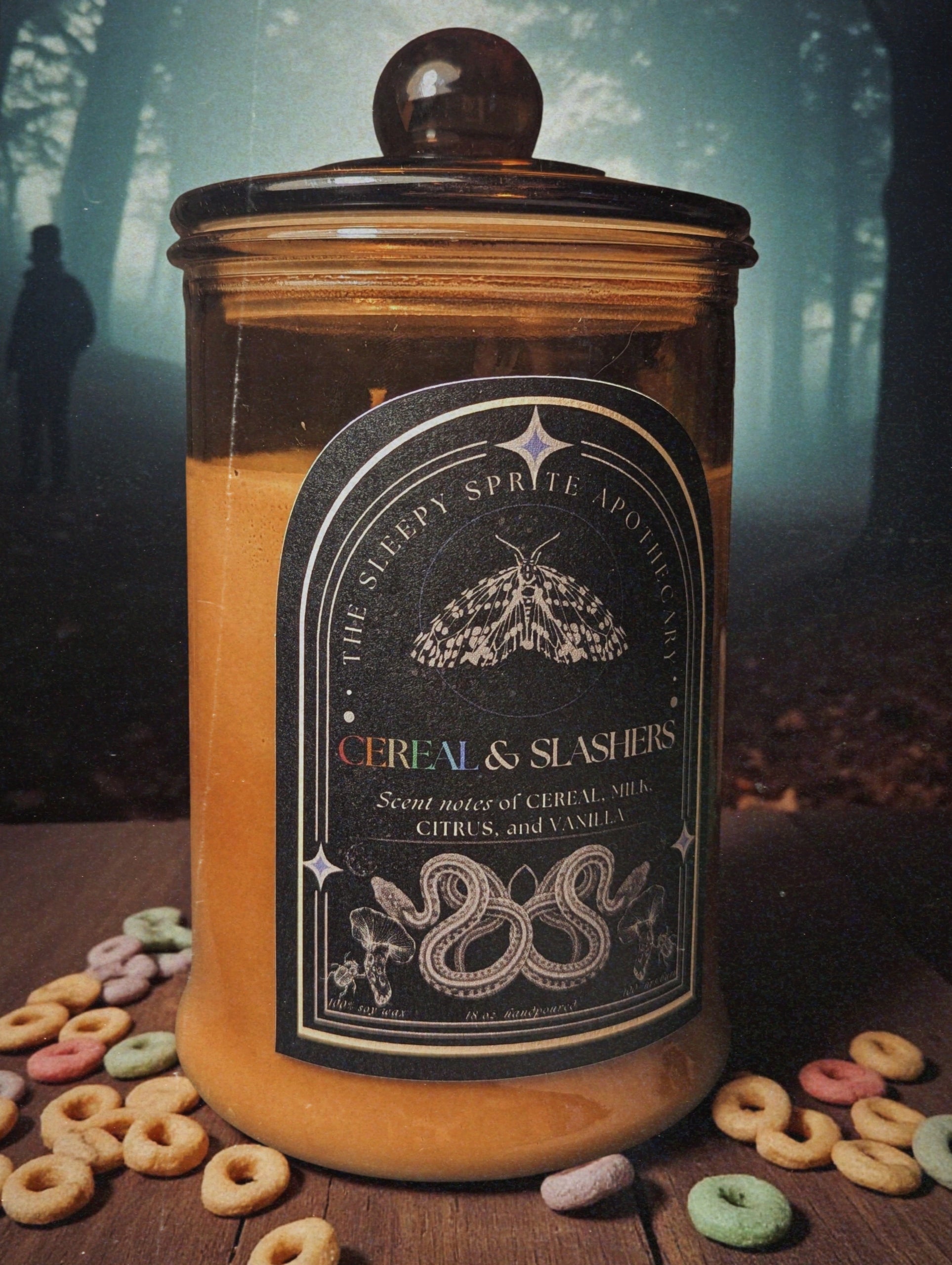 Candle jar labeled 'Cereal & Slashers' with cereal and candy on a wooden surface from the Sleepy Sprite Apothecary. Witchy dark cottagecore aesthetic. Fruit loops scented candle.