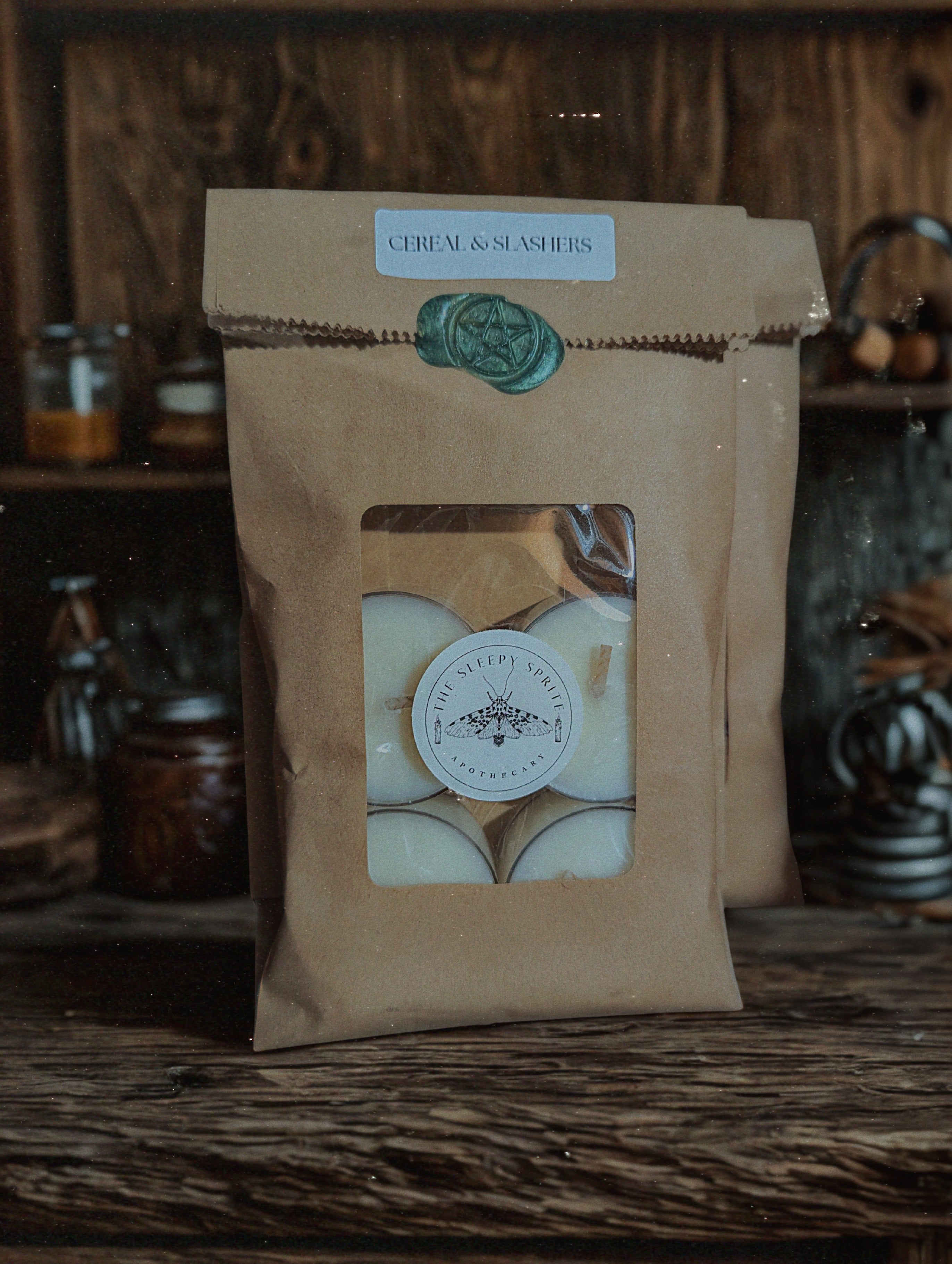 Kraft paper packaging tealight candles with a window displaying white items on a wooden surface. Witchy dark cottagecore aesthetic. Fruit loops scented candle 