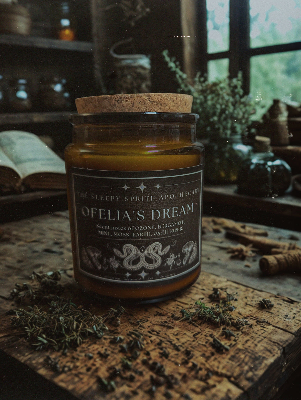 Jar of 'Ophelia's Dream' candle with a rustic background. Witchy dark cottagecore aesthetic. Pan's Labyrinth inspired candle.