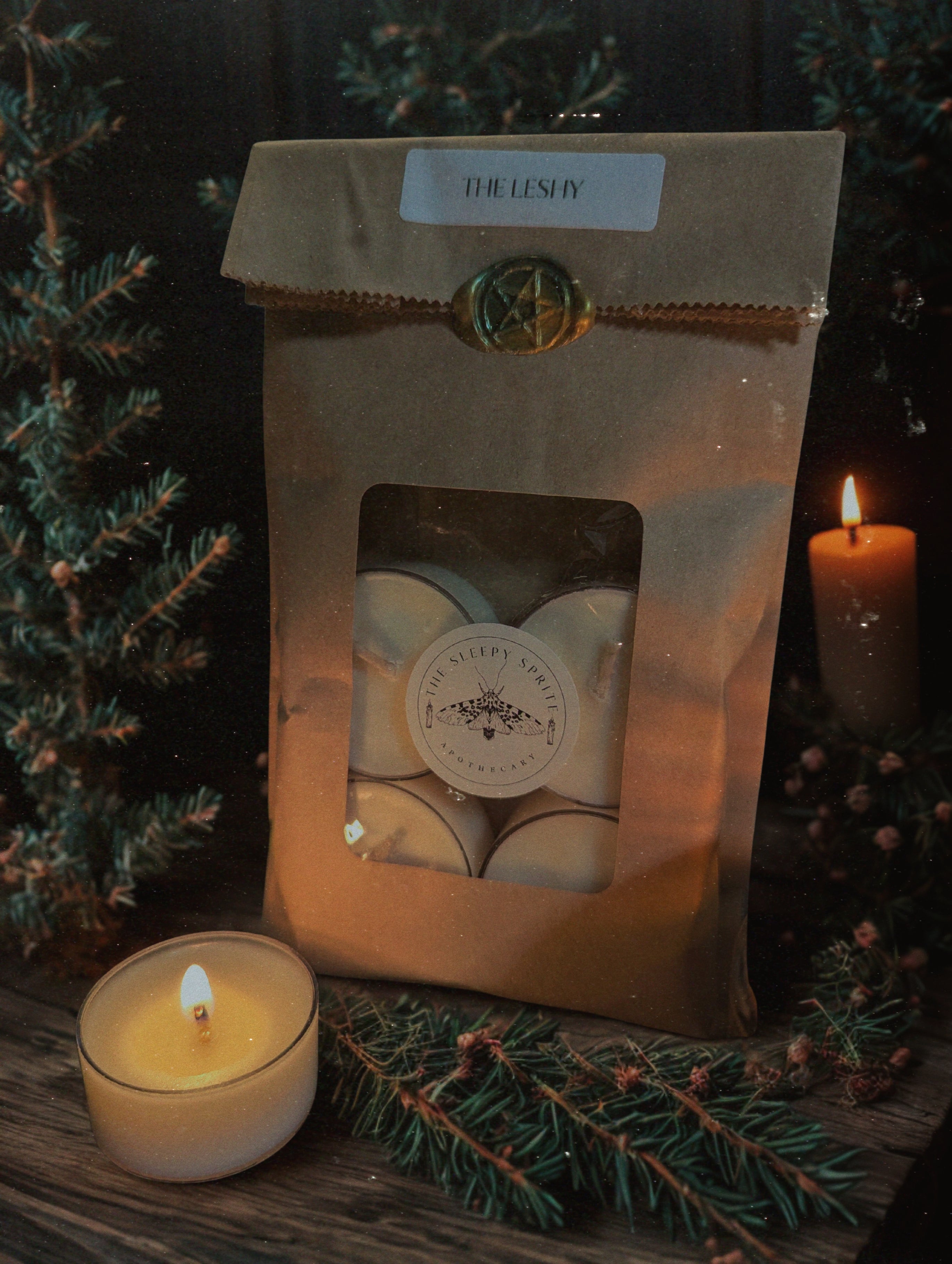 Package of tealight candles on a dark background. Witchy dark cottagecore aesthetic.